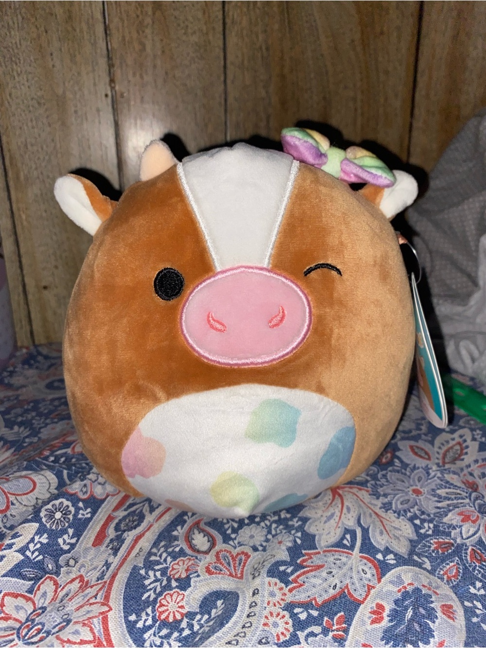 Squishmallows Brown and White Cow Plush with Pink Snout and Pastel Spots Bow